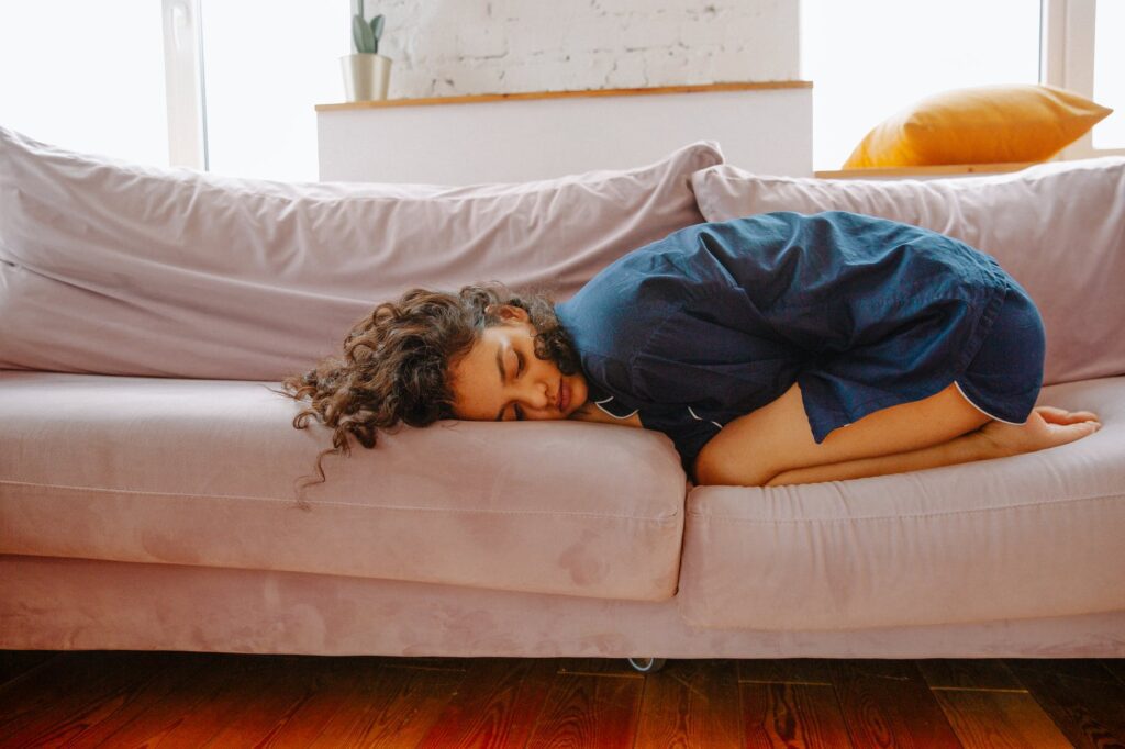 woman lying on couch